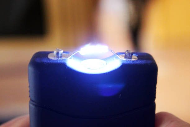 Self defense Stun gun in man's hand